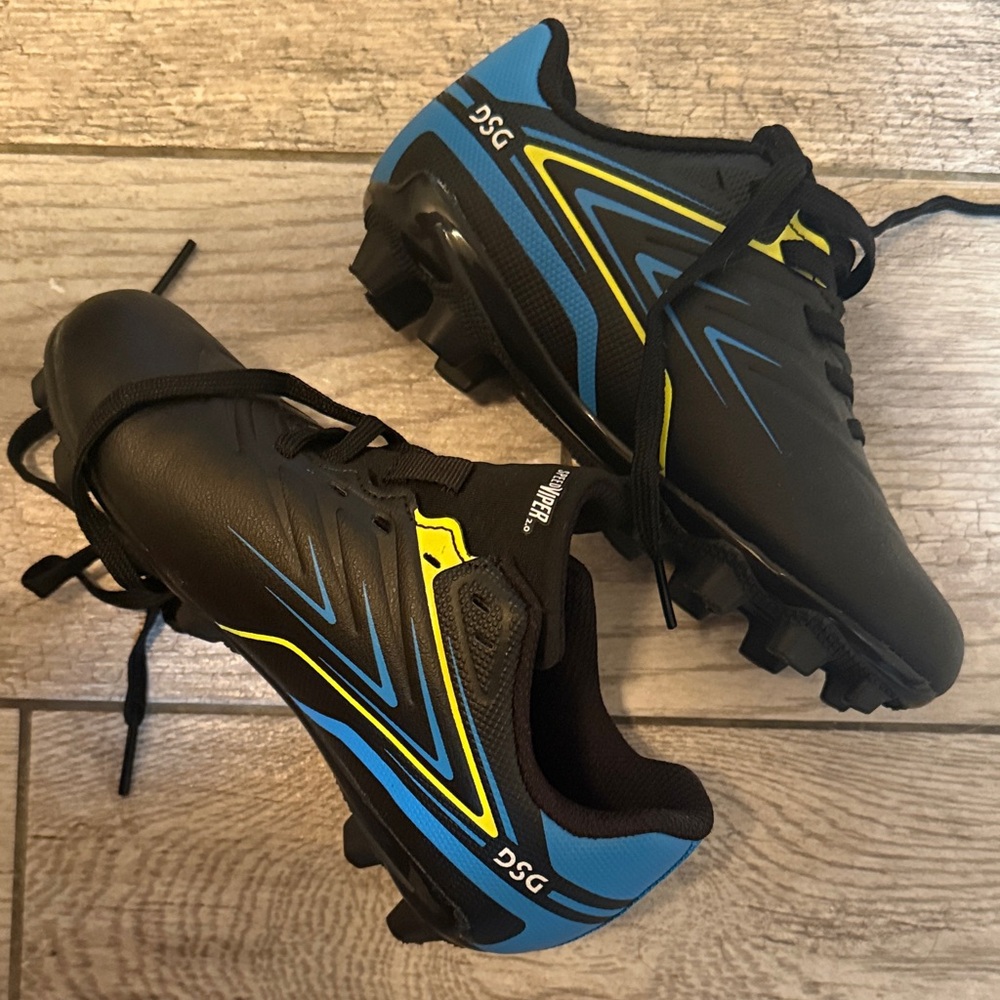 DSG Kids Black cleats with Blue and Yellow Accents/ never warn